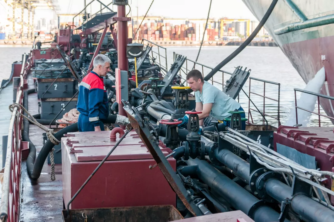 engineers-working-on-ship-deck-machinery
