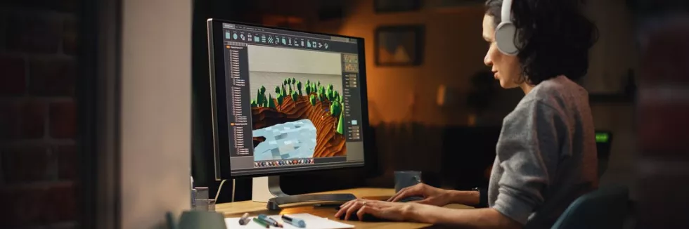 3D-Graphics-and-Game-Art-Masters-test-female-video-game-designer-works-on-a-new-3d-level-on-person
