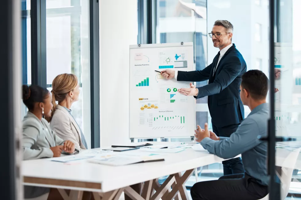 business-presentation-strategy-meeting-corporate-man-showing-finance-data-team-accounting-management-office-group-collaboration-while-working-planning-financial-marketing-project