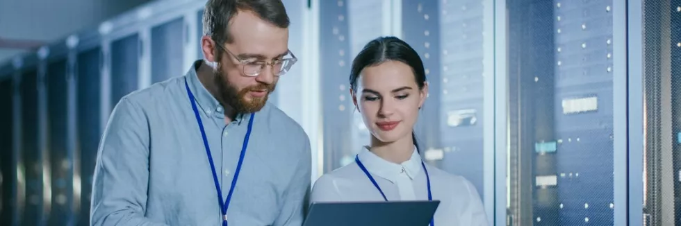 Security-and-Continuity-of-IT-test-bearded-it-technician-in-glasses-and-beautiful-young-enginee