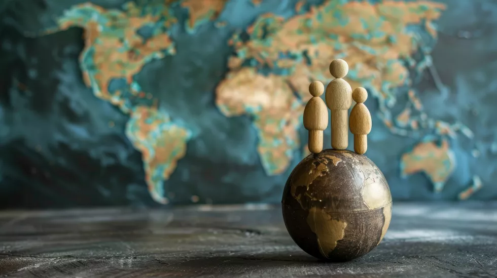 wooden-figures-globe-front-world-map-symbolizing-global-unity-population