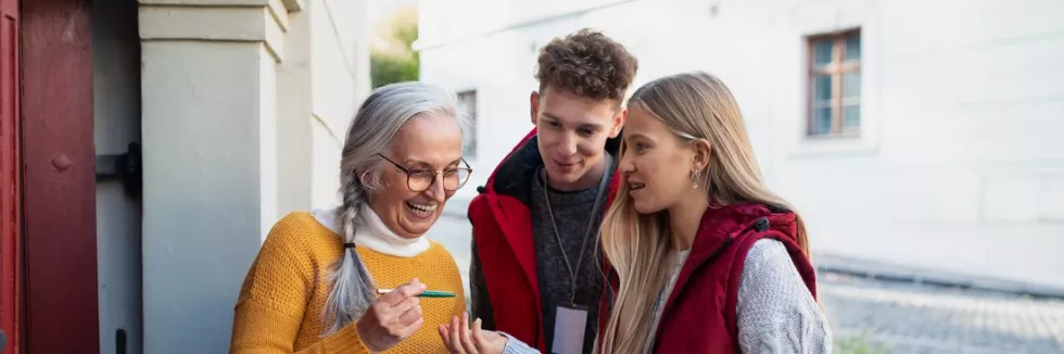 Applied-Anthropology-test-young-door-to-door-volunteers-talking-to-senior-woman-and-ta