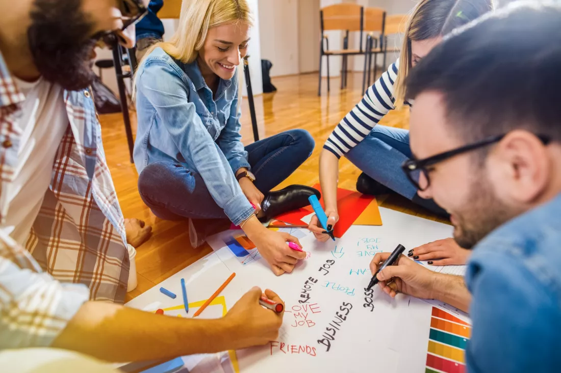 creative-students-brainstorming-on-large-paper