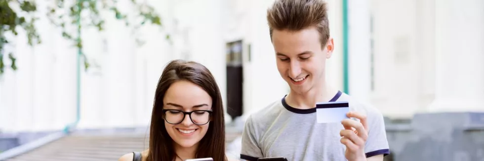 Banking-and-Financial-Innovations-test-happy-students-using-cards-for-buying-goods-online-attractiv