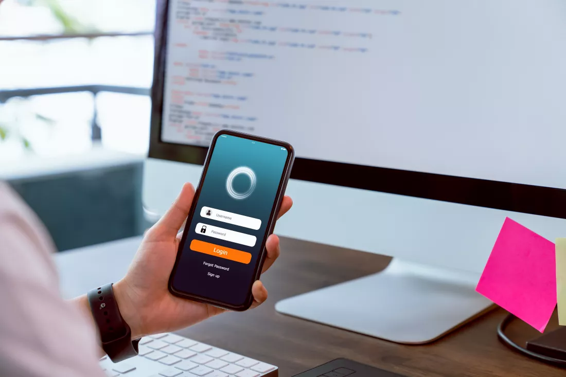 designer-holding-smartphone-design-applications-with-test-performance-before-sending-customers-concept-working-online-system