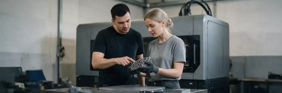 engineers-inspecting-a-3d-printed-metal-part-test