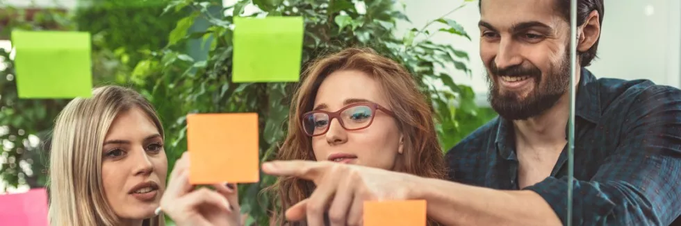 Brand-Management-test-creative-professionals-are-standing-and-discussing-at-the-of