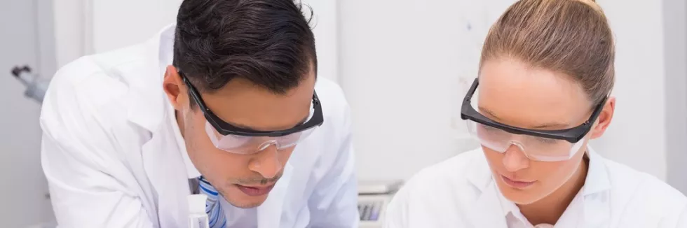 Clinical-Nutrition-and-Dietetics-test-concentrate-scientists-injecting-tomato