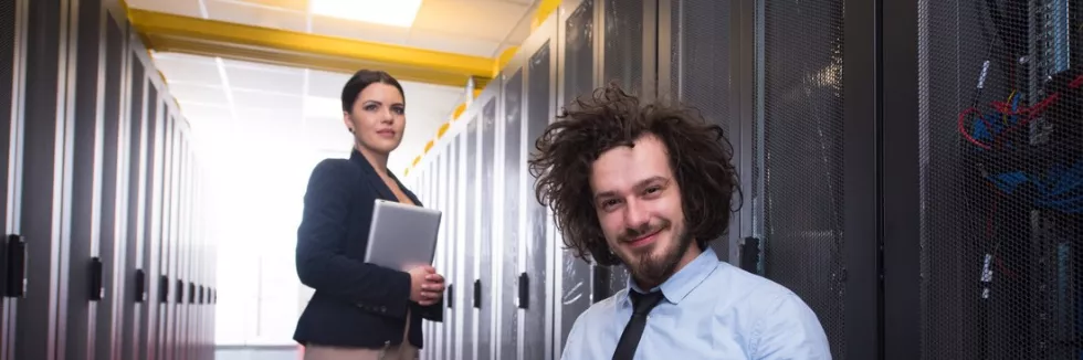 Cloud-Computing-Management-test-team-of-young-technicians-working-together-on-servers-at-the