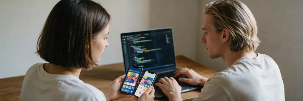 students-testing-a-mobile-app-on-two-smartphones