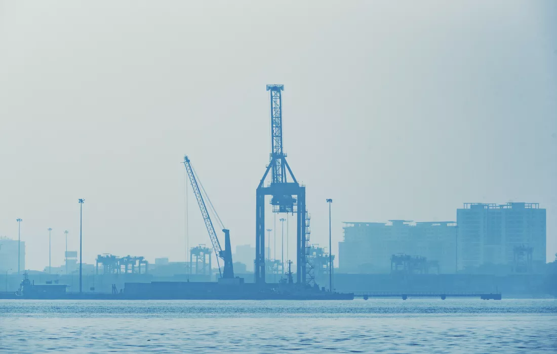 cranes-commercial-dock-against-clear-sky