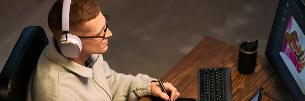 creating-computer-games-young-adult-caucasian-man-using-digital-tablet