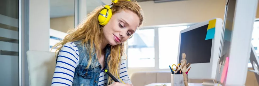 creative-design-ba-smiling-designer-working-with-digitizer-and-listening