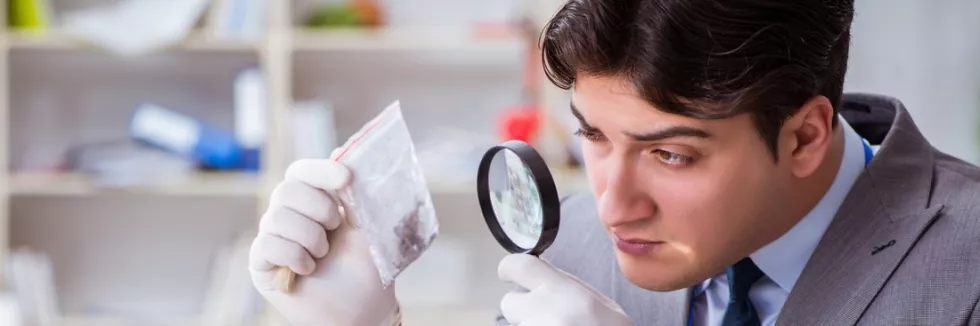 criminology-and-forensic-science-young-man-during-crime-investigation-in-office