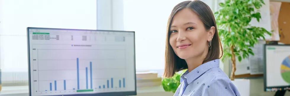 data-analytics-portrait-of-young-business-woman-working-at
