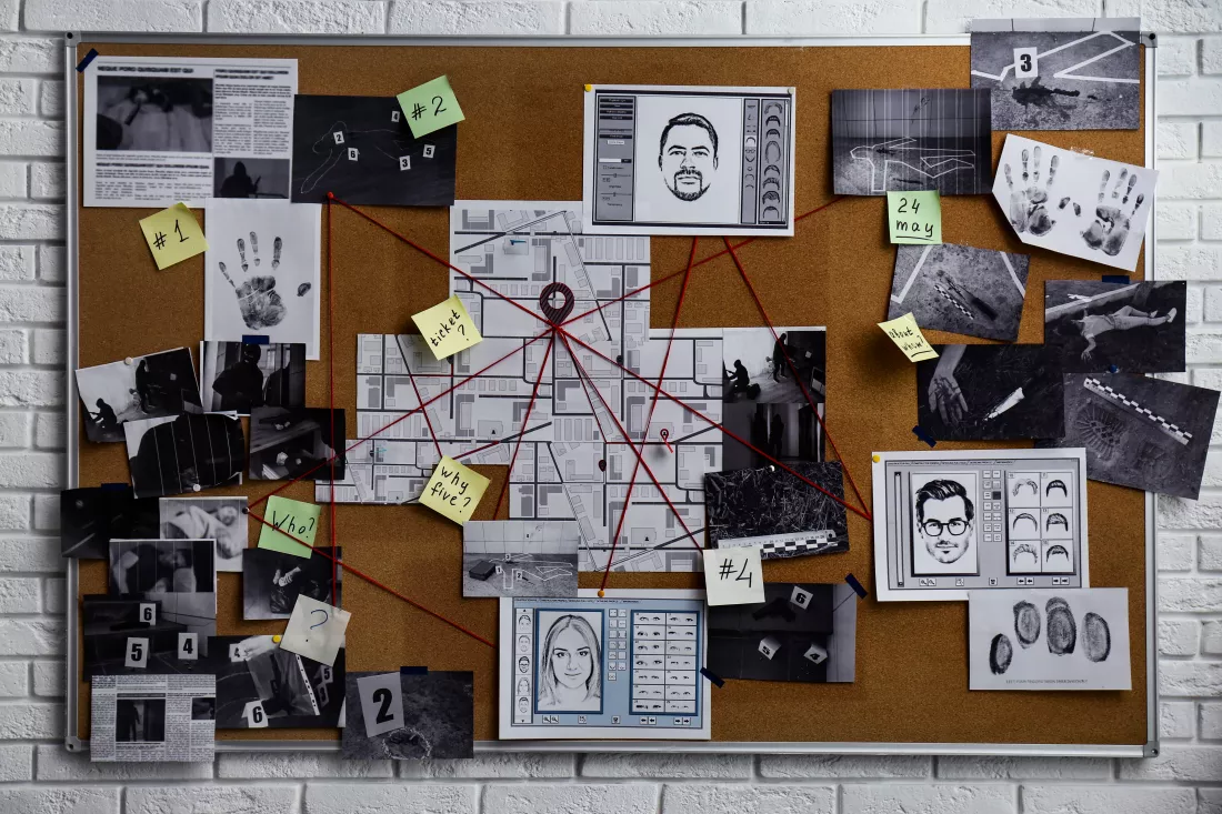 detective-board-with-fingerprints-photos-map-clues-connected-by-red-string-white-brick-wall
