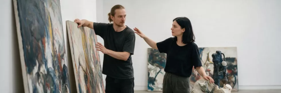 artists-arranging-artworks-for-an-exhibition