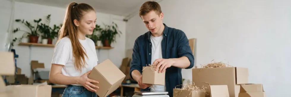 business-students-comparing-recycled-packaging-in-a-workshop